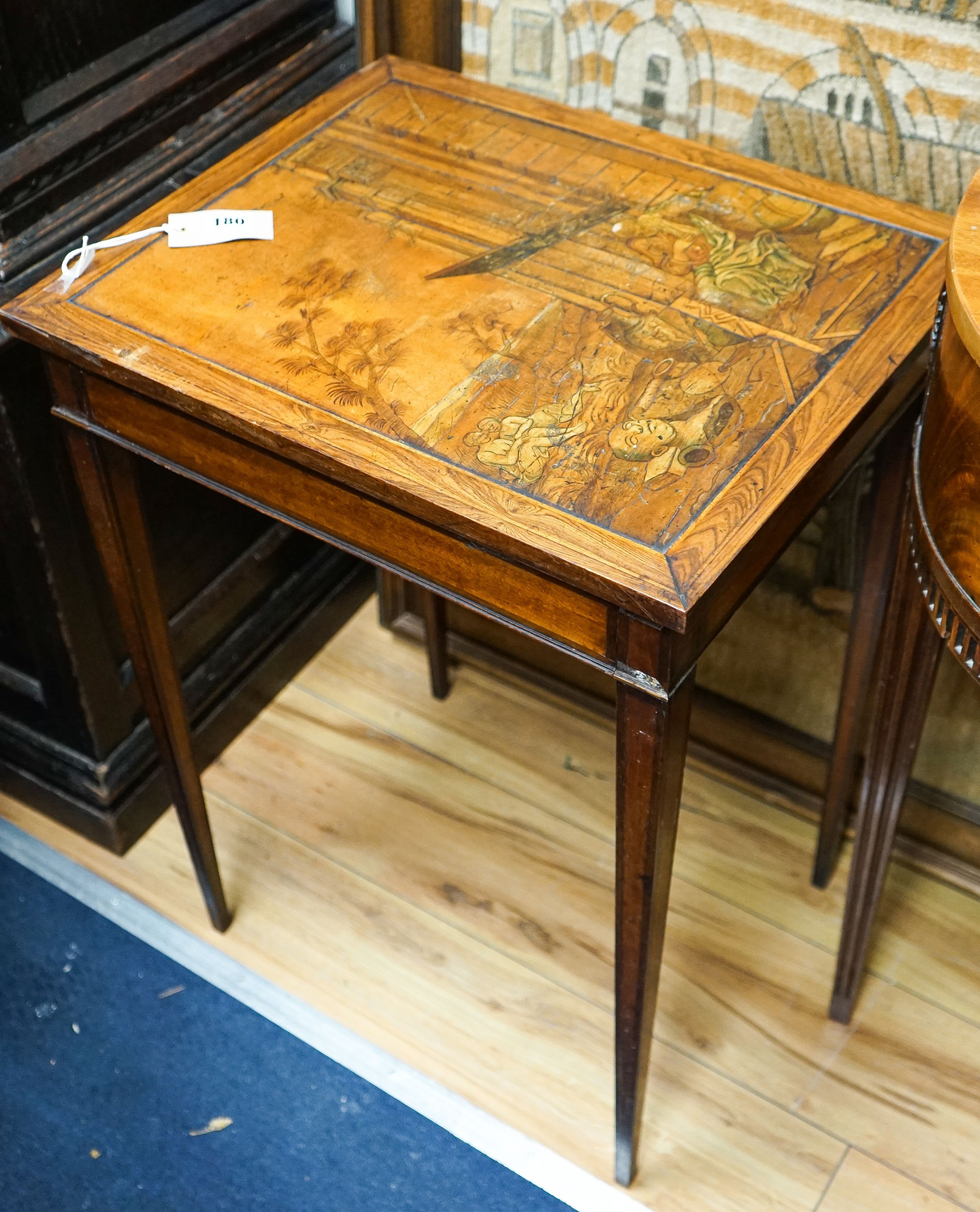 A 19th century Continental walnut side table, the top with penwork decoration and a tinted scene of figures among Roman ruins, width 41cm, depth 50cm, height 69cm
